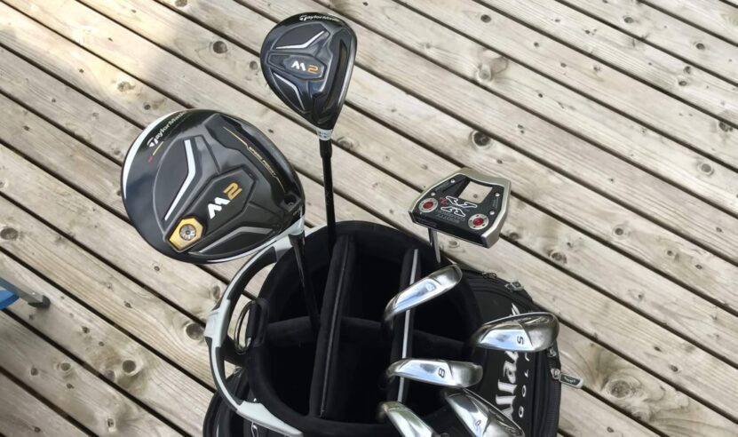 Multiple golf clubs in a golf bag