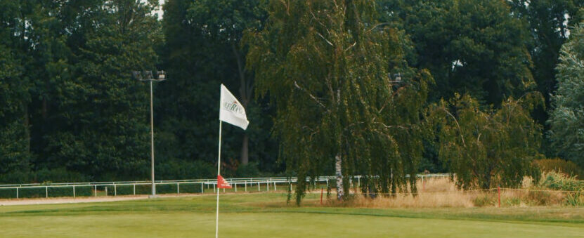 A golf course with windy conditions